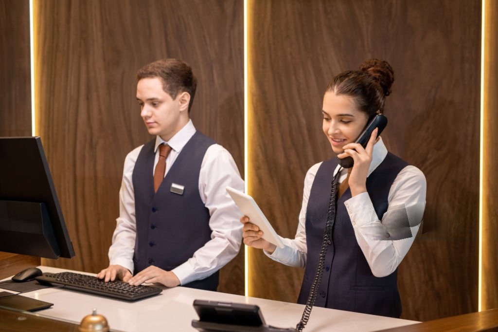 Front Office management training students at reception desk in IICE Private Limited hospitality institute